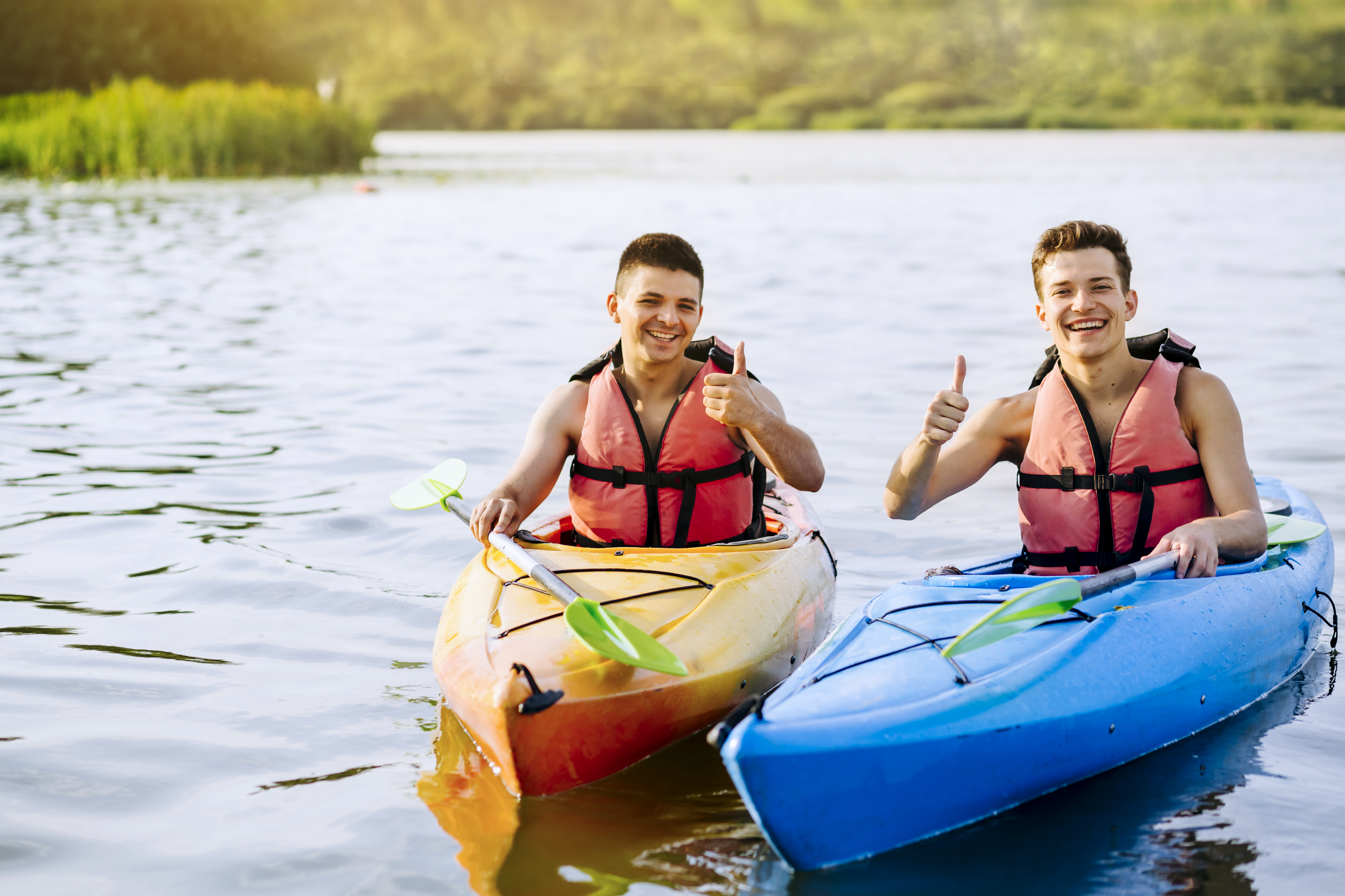 smiling-two-male-kayaker-showing-thumb-up-sign
